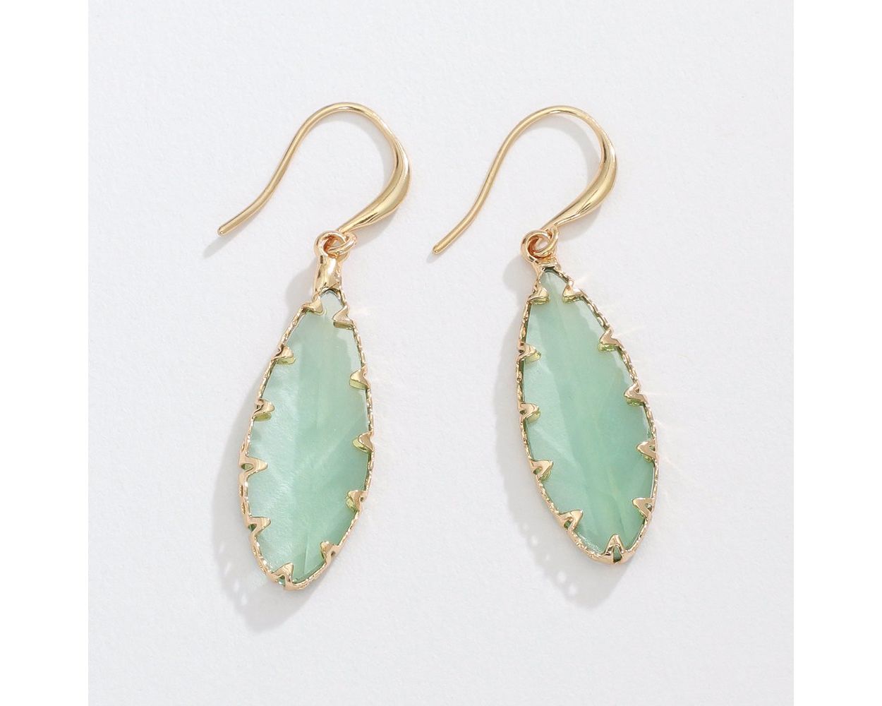 Faceted soft mint crystals in gold earrings